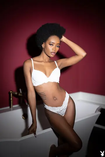 Woman with Short Hair Undresses and Bathes in the Tub