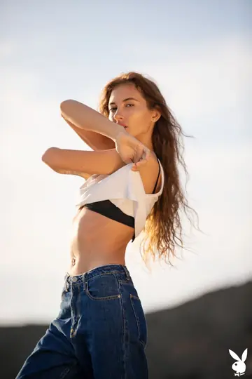 Slim Busty Brunette Strips Out of Her Jeans on the Beach