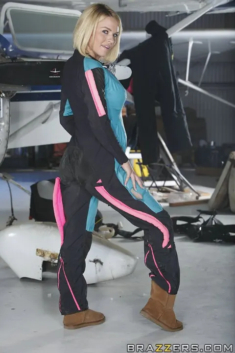 Krissy Lynn: Blonde Unzips Jumpsuit and Spreads Her Pussy in Aircraft Hangar – photo 2 of 18
