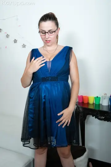 Curvy MILF in a Dress and Glasses Fingers Herself and Uses a Dildo