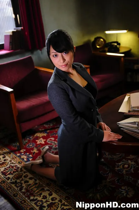 Japanese MILF in Uniform Adjusts Her Glasses at Her Desk – photo 3 of 12
