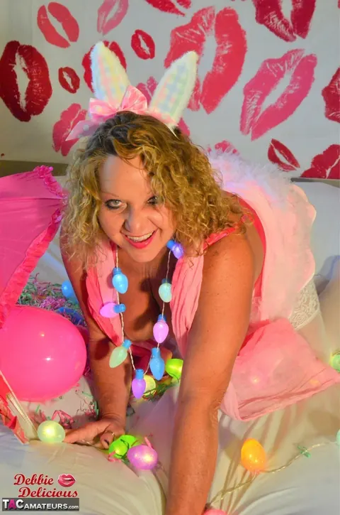 Debbie Delicious: Mature Curvy Brunette in Costume Poses and Shows Her Big Tits – photo 11 of 16