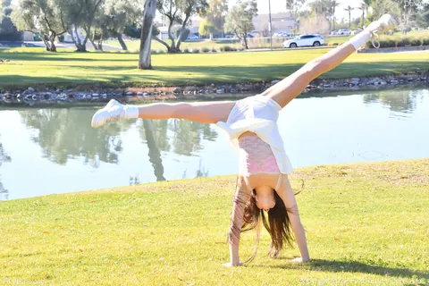 Dakota Tyler: Petite Amateur Flashes Her Natural Tits and Handstands by the River – photo 10 of 20