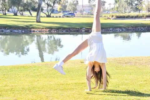 Dakota Tyler: Petite Amateur Flashes Her Natural Tits and Handstands by the River – photo 11 of 20