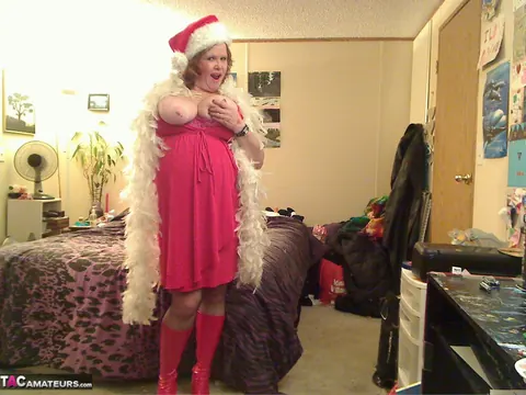 Misha Milf: Thick Redhead MILF Unwraps Christmas Outfit in Boots – photo 13 of 20