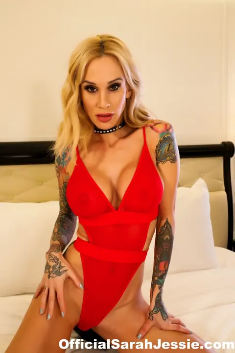 Sarah Jessie: Tattooed Blonde MILF Strips Out of Her Bodysuit on the Bed – photo 1 of 12