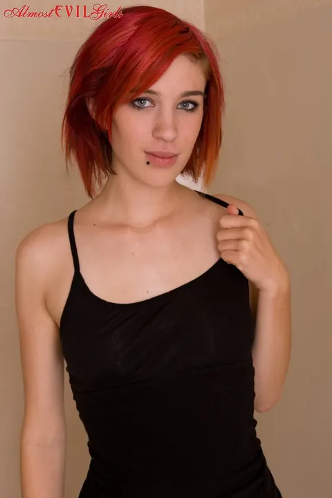 Redhead Oils Up and Shaves Her Pussy in the Bathroom – photo 3 of 15