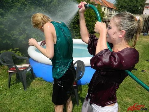 Two Women Kiss in an Outdoor Pool – photo 15 of 15