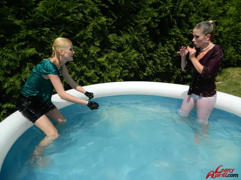 Two Women Kiss in an Outdoor Pool – photo 10 of 15