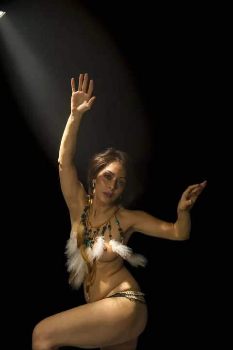 Short-Haired Woman with Small Tits Dances Nude – photo 10 of 21