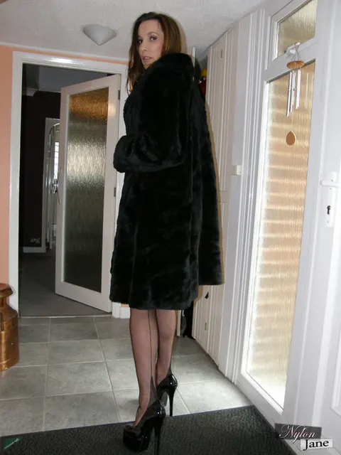 Nylon Jane: Thick Brunette MILF Lifts Stockinged Foot in a Latex Skirt – photo 12 of 15