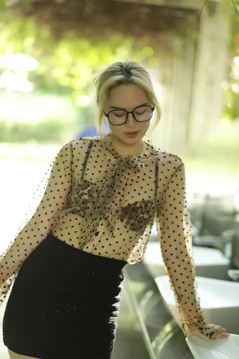 Asian Blonde in Glasses and Skirt Strips Outdoors – photo 17 of 21