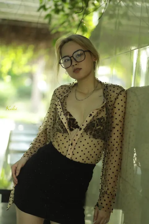 Asian Blonde in Glasses and Skirt Strips Outdoors – photo 10 of 21
