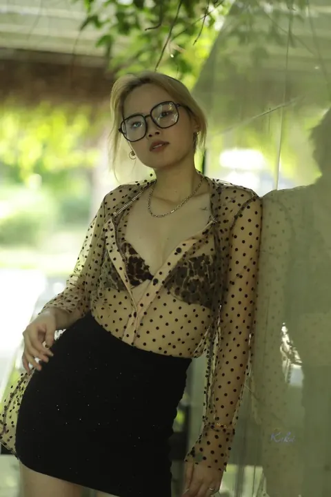 Asian Blonde in Glasses and Skirt Strips Outdoors – photo 11 of 21