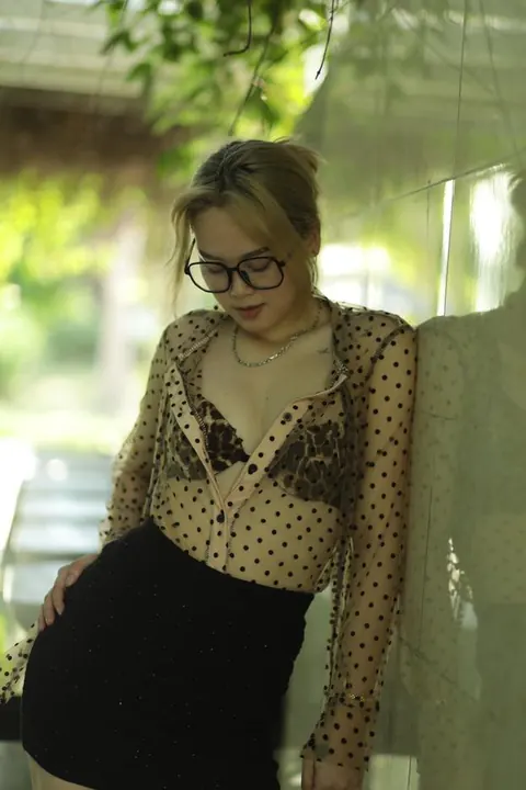 Asian Blonde in Glasses and Skirt Strips Outdoors – photo 8 of 21