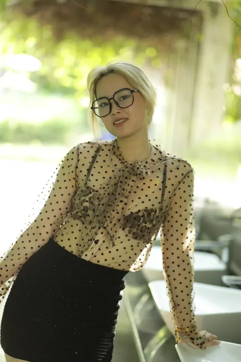 Asian Blonde in Glasses and Skirt Strips Outdoors – photo 18 of 21