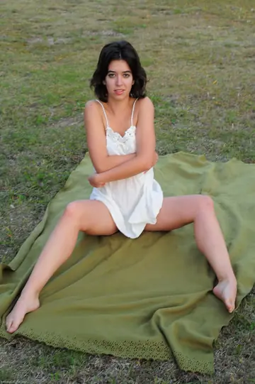 Latina Strips Nude and Poses for Erotic Photos