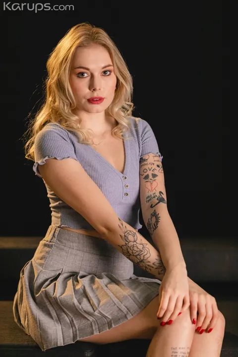 Mimi Cica: European Blonde Shows Off Her Tattoos and Piercings Clothed – photo 1 of 21