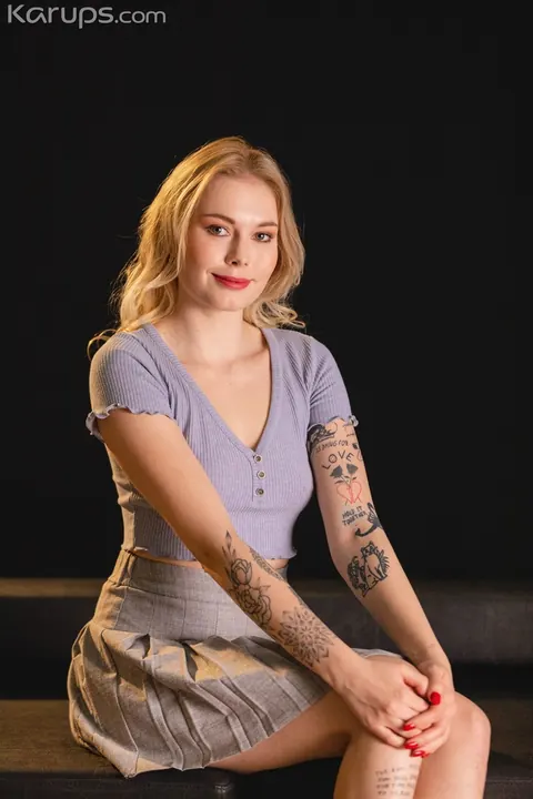 Mimi Cica: European Blonde Shows Off Her Tattoos and Piercings Clothed – photo 2 of 21