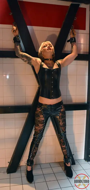 Short-Haired Blonde in Leather and Heels Restrained with a Horse Bit