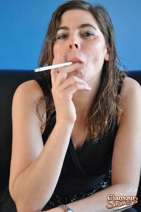 Woman Strips to Panties While Smoking a Cigarette – photo 4 of 15