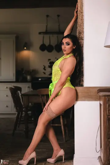 Busty Tattooed Brunette Strips Off Her Lingerie and Stockings in Heels