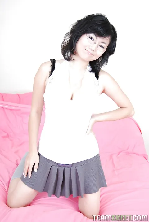 Chi Yoko: Asian Brunette Spreads Her Shaved Pussy in a Skirt – photo 2 of 16