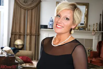Short-Haired MILF with Big Tits Strips Out of Her Stockings