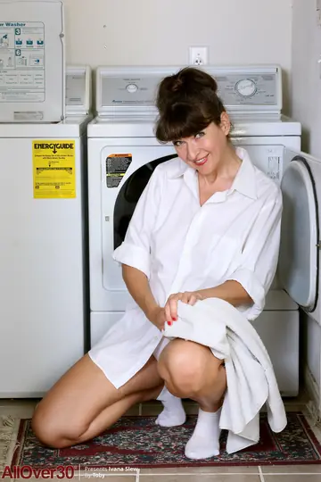 Busty MILF Undresses While Doing Laundry and Spreads Her Pussy