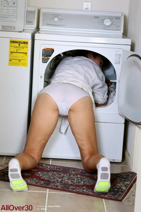 Busty MILF Undresses While Doing Laundry and Spreads Her Pussy – photo 3 of 21