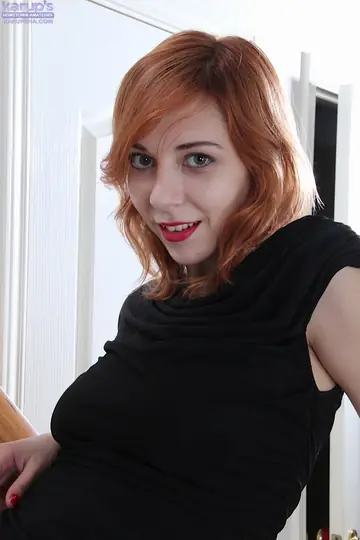 Nancy Reid – Redhead Keeps Heels On While Fingering Her Shaved Pussy