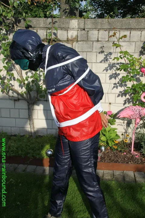 Woman Stands Bound in Restraints Outdoors – photo 13 of 16