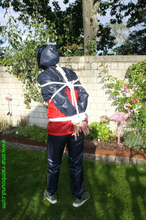 Woman Stands Bound in Restraints Outdoors – photo 8 of 16