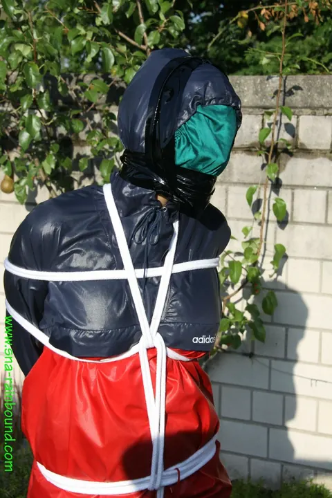 Woman Stands Bound in Restraints Outdoors – photo 5 of 16