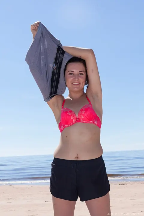 Hairy Woman in a Bikini Spreads Her Pussy on the Beach – photo 2 of 16