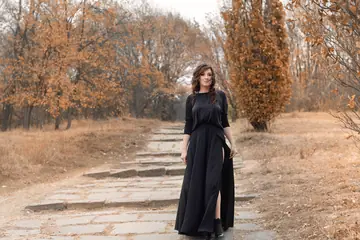 Brunette Amateur Lifts Her Black Dress to Flash Outdoors