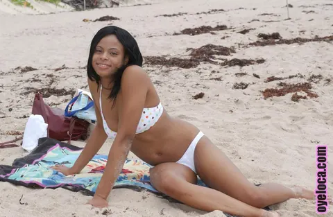 Nina Bell: Busty Ebony Latina Suns Her Tits in a Bikini on the Beach – photo 9 of 16