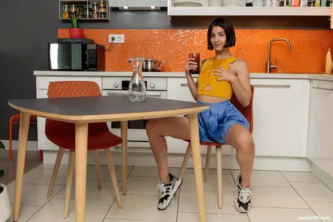 Sasha X Ray: Short-Haired Brunette Lifts Her Skirt and Spreads in the Kitchen – photo 3 of 21