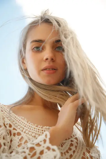 Slim Blonde Strips Out of Her Dress and Spreads on Rocky Ground