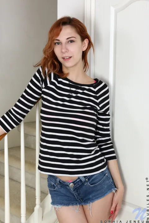 Nancy Reid: Busty Redhead Drops Her Shorts and Spreads Her Ass and Pussy – photo 2 of 15