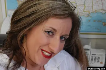Mature Busty Woman Undresses and Spreads Her Labia in the Office