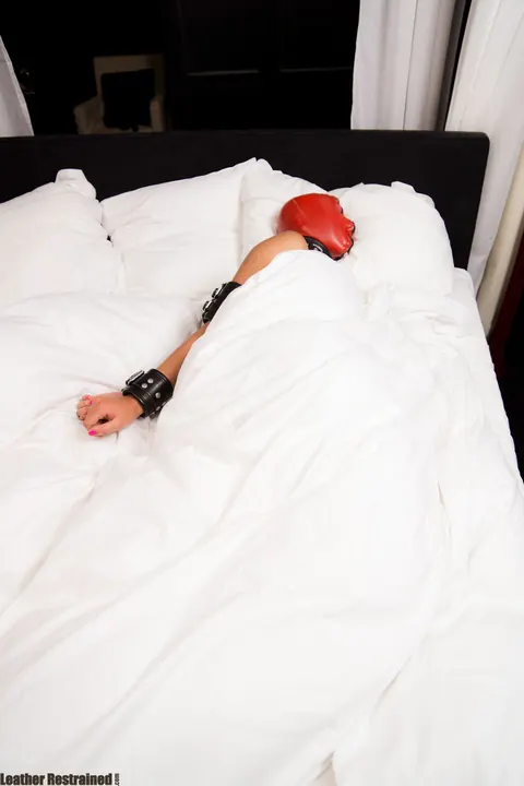 Woman in Leather Bound and Restrained for Breath Play – photo 12 of 16
