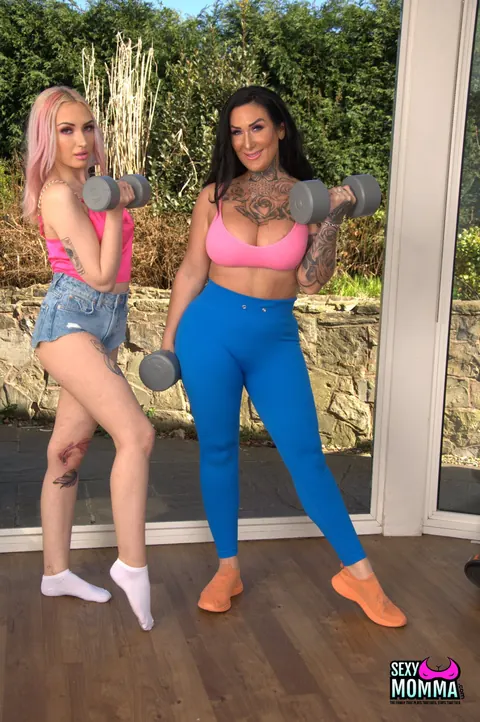 Ella Bella: Petite Tattooed MILF Undresses and Uses a Dildo with Female Partner – photo 2 of 21