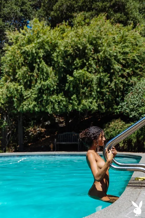 Tanned Woman Strips Out of Her Bikini by the Pool – photo 10 of 20