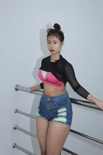 Busty Asian Brunette Strips Out of Her Shorts and Glasses