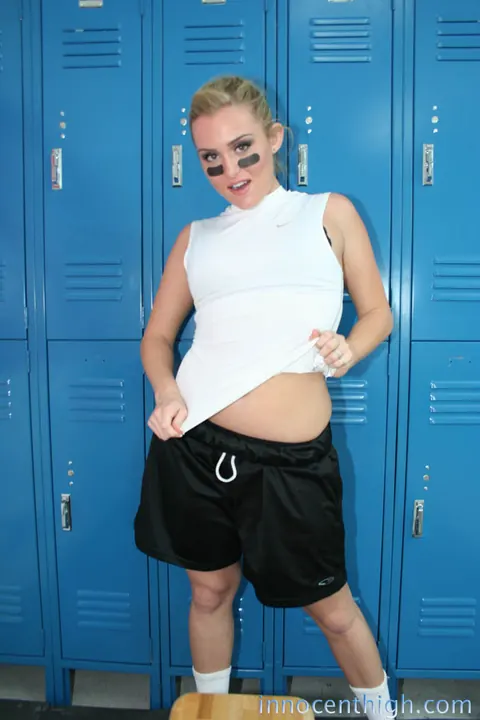 Ruby Ryder: Short-Haired Brunette Strips Off Her Football Uniform in the Locker Room – photo 11 of 19