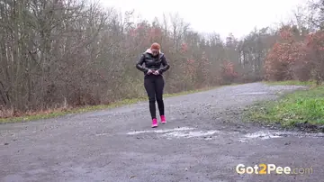 Skinny Pale Redhead in Leather Spreads Her Legs on a Rural Road