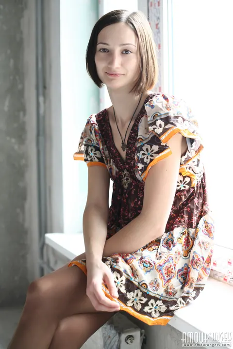 Skinny Brunette Shows Off Her Small Tits on the Window Sill – photo 4 of 20