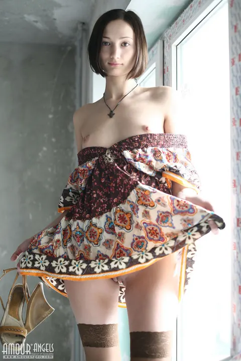 Skinny Brunette Shows Off Her Small Tits on the Window Sill – photo 18 of 20