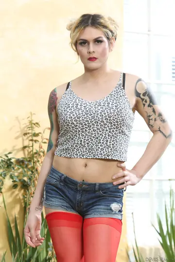 Tall Tattooed Trans Woman Takes Bareback Anal on the Sofa